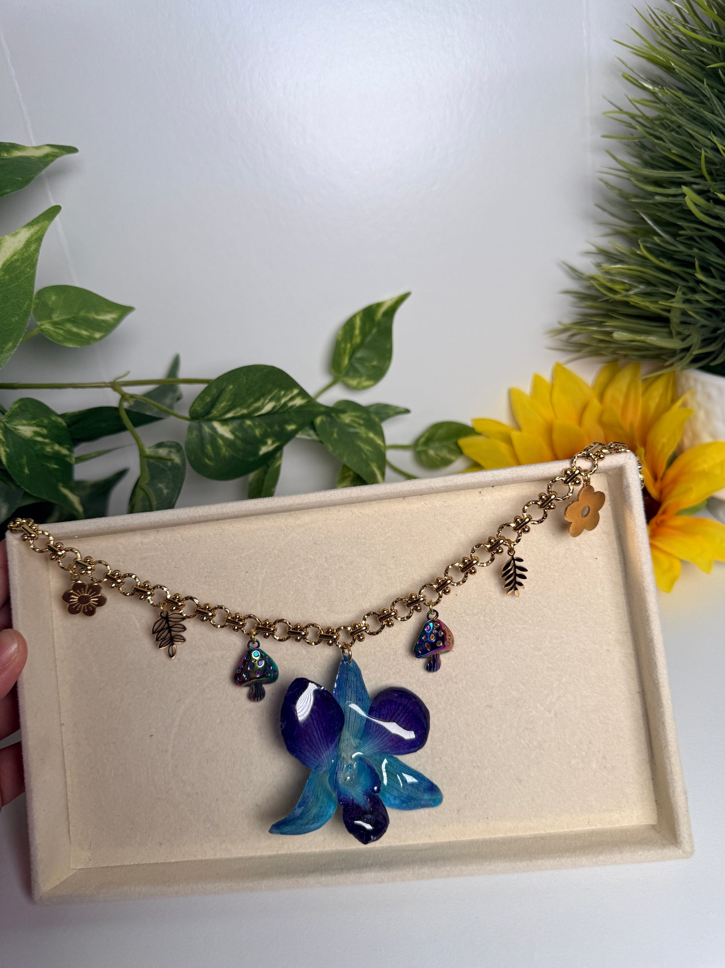Blue orchid charm necklace