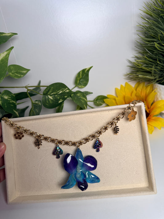 Blue orchid charm necklace