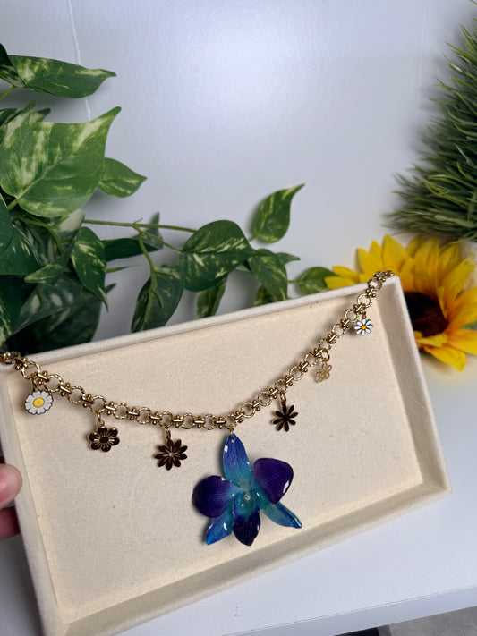 Blue orchid charm necklace