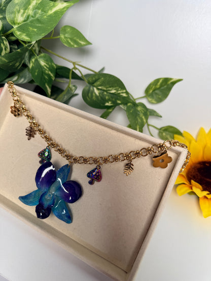 Blue orchid charm necklace