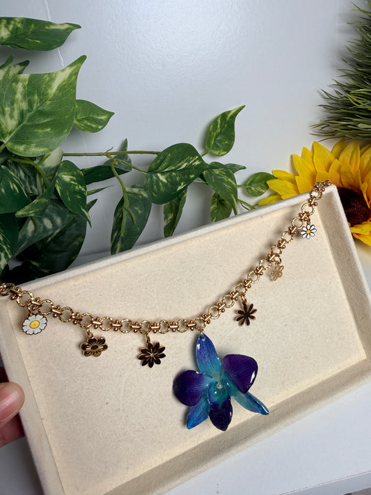 Blue orchid charm necklace