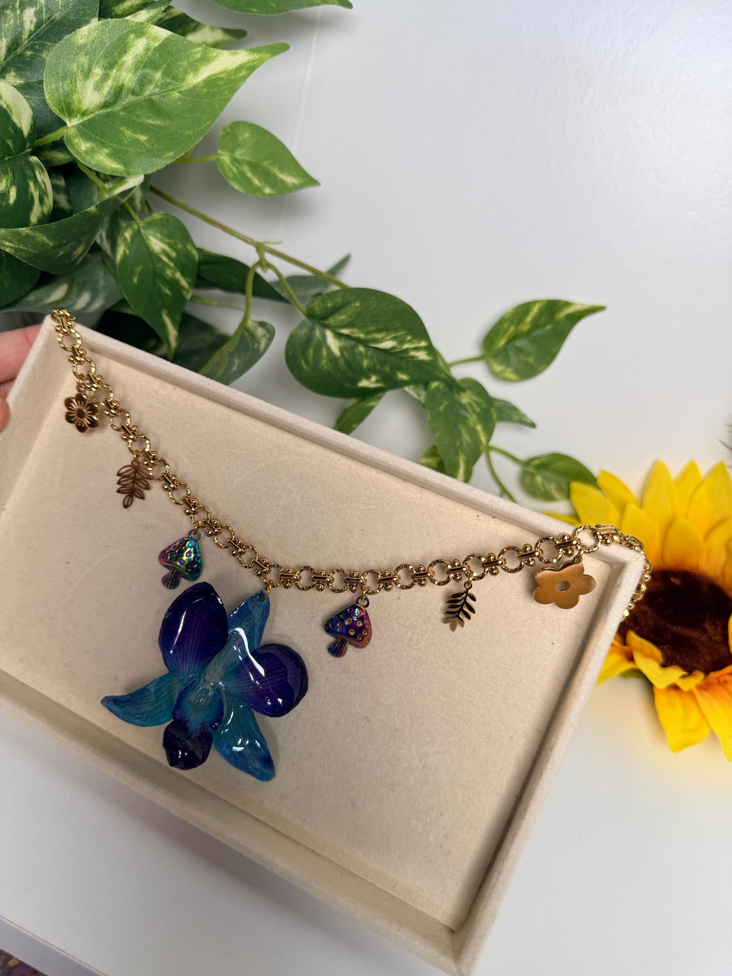 Blue orchid charm necklace