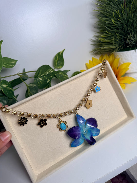 Blue orchid charm necklace